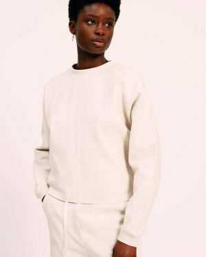INDI is made from a comfortable jersey-cotton blend. This pullover has a rounded neckline, vertical stitching on the front, and a raw finish